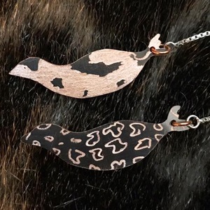 Double sided earrings qairulik and natchiq on copper with sterling silver ear threads