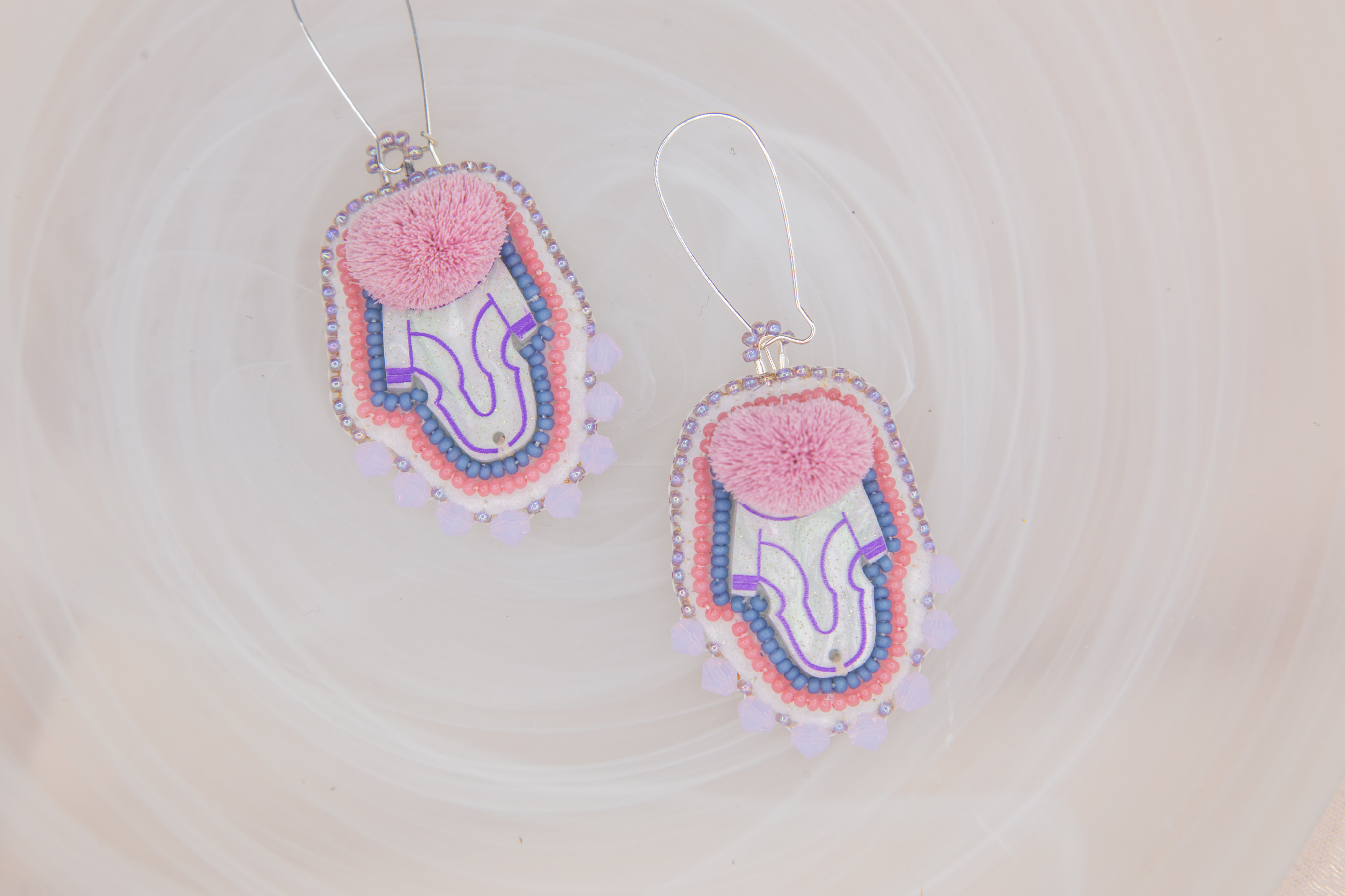 Tufted Amauti (2024) acrylic centre with dyed caribou fur and beadwork