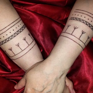 Traditional family wrist tattoos done in Iqaluktuuttiaq, 2021