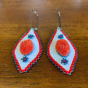 Red caribou-hair tufted earrings (2021)