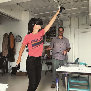 wearing a VIVE VR headset immersed in a virtual reality experience, 2018