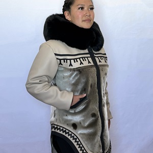 May and Elizabeth Ningeongan, Beige/black tunniit tattoo leather design parka (2022) With Elizabeth Ningeongan. Model Dawn Siutinuar