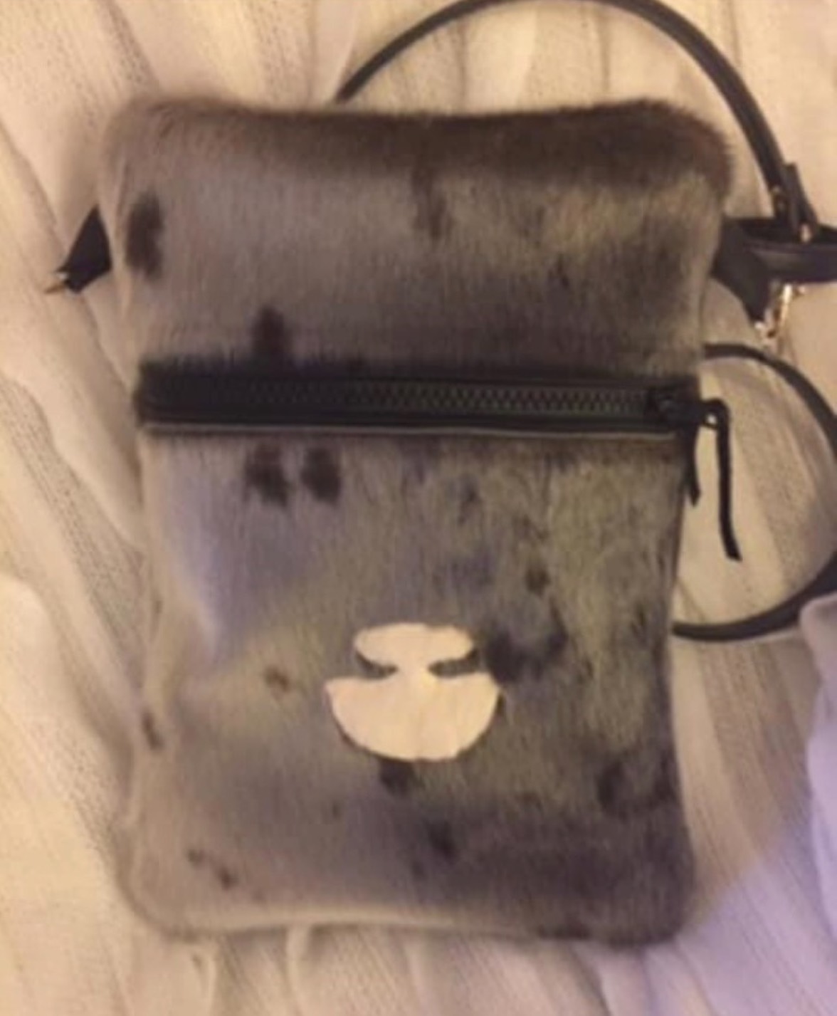 Untitled (Sealskin pouch with ulu)