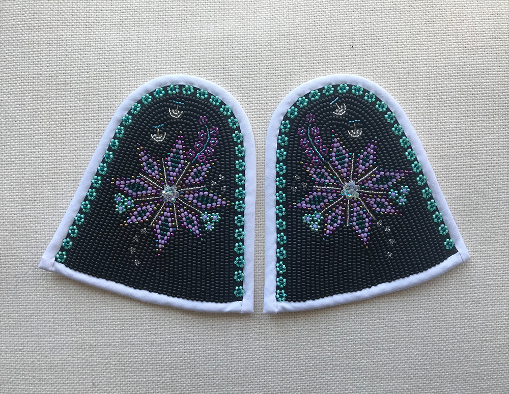 Qallinik with white and bias tape, black background and purple flower (2020)