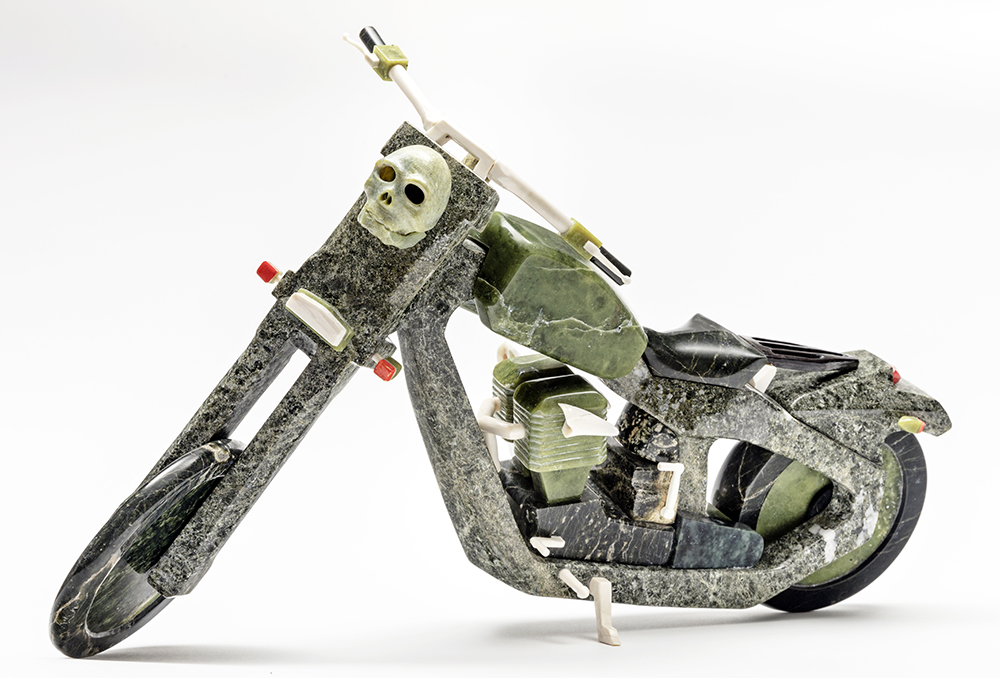 By Jamasee Pitseolak - Aroara (2012) Stone, caribou antler, ivory, dye and metal